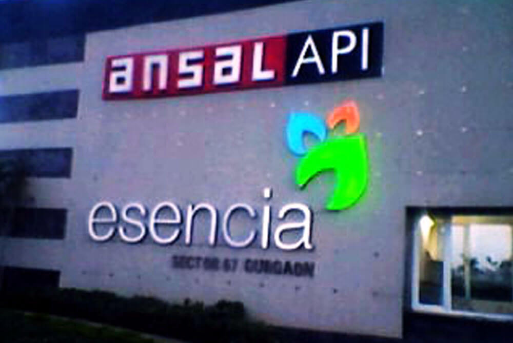 <span>Main Wall Signage</span><i>→</i>